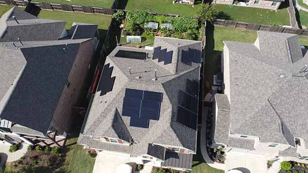 Stallion Roofing & Solar Solutions Roofing job - aerial of house with solar panels installed